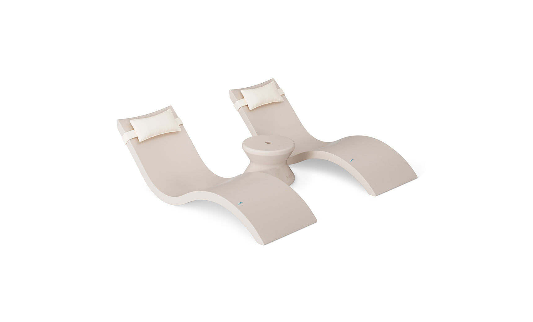 The Ledge Lounger Signature Chaise Headrest Pillow and Side Table In-Pool Set features two modern beige loungers with white pillow headrests, joined by a round side table—ideal for relaxing poolside or creating an outdoor oasis. Plain white background.