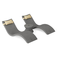 The Ledge Lounger Signature Chaise Headrest Pillow and Side Table In-Pool Set features two curved gray loungers, tan headrest pillows, and a round side table—ideal for upgrading your poolside paradise.