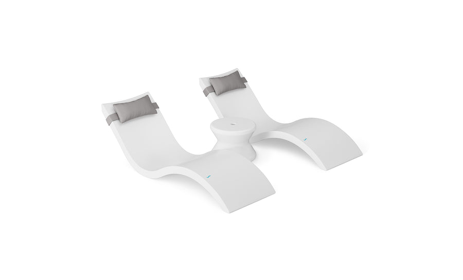 The Ledge Lounger Signature Chaise Headrest Pillow and Side Table In-Pool Set features two modern white loungers with grey headrests, joined by a round side table—an ideal poolside upgrade for your outdoor space, shown on a white background.