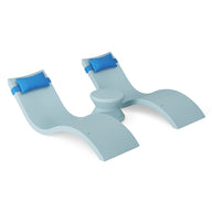 The Ledge Lounger Signature Chaise Headrest Pillow and Side Table In-Pool Set features two light blue chaise loungers with attached headrests connected by a center side table, perfect for your outdoor paradise on a bright white background.