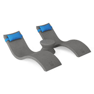 The Ledge Lounger Signature Chaise Headrest Pillow and Side Table In-Pool Set offers modern gray loungers with blue headrests and a round table—ideal for relaxing on your pool ledge and turning your space into an outdoor paradise.