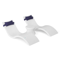 The Ledge Lounger Signature Chaise Headrest Pillow and Side Table In-Pool Set features two modern white chaise loungers with blue headrests connected by a sleek round table, ideal for relaxing and elevating your outdoor space.