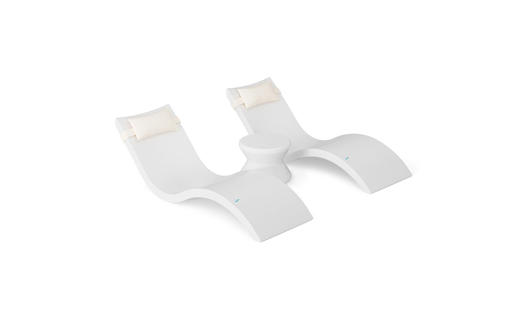The Ledge Lounger Signature Chaise Headrest Pillow and Side Table In-Pool Set offers two modern white loungers with cream headrest pillows, connected by a round table—perfect for poolside relaxation against a sleek white backdrop.