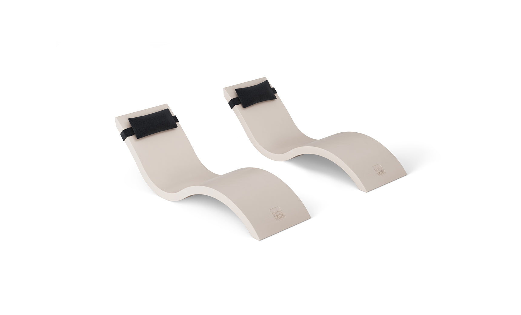 The Outdoor Escape In-Pool Furniture Bundle by Ledge Lounger, featuring two sleek chaise lounges with wave-like designs and black headrests, creates a stylish statement against a plain white background.