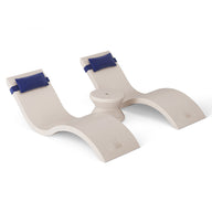 The Ledge Lounger Outdoor Paradise In-Pool Furniture Bundle features a modern, minimalist cream balance board with curved sections and blue padded straps. Ideal for pool ledge furniture aficionados, its elegant design blends seamlessly against a plain white background.