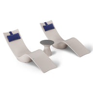 Ledge Loungers Resort Luxury Outdoor Paradise In-Pool Furniture Bundle includes two modern beige lounge chairs with blue headrests and a small round table, all in a minimalist style. This set evokes poolside relaxation and is showcased on a white background.