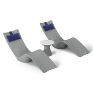 The Resort Luxury Outdoor Paradise In-Pool Furniture Bundle by Ledge Lounger features two sleek, curved gray lounge chairs with blue cushions flanking a small round white table, creating a minimalist and contemporary poolside setup perfect for any outdoor space.