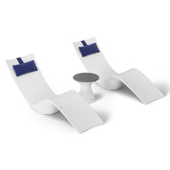 The Resort Luxury Outdoor Paradise In-Pool Furniture Bundle by Ledge Lounger features two modern white chaise loungers with blue headrests side by side and a small round table with a gray top, ideal for poolside relaxation, all set against a minimalist white background.