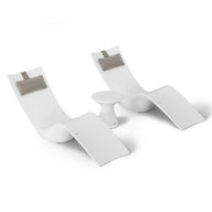 The Resort Luxury Outdoor Paradise In-Pool Furniture Bundle by Ledge Lounger features two sleek white chaise loungers with gray headrests and a small round white table, ideal for poolside relaxation.