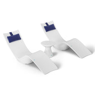 The Ledge Lounger Resort Luxury Outdoor Paradise In-Pool Furniture Bundle includes two modern white chaise loungers with blue headrests and a small white round table, perfect for poolside relaxation. Their minimalist design stands out against a plain white background, creating a serene and luxurious vibe.