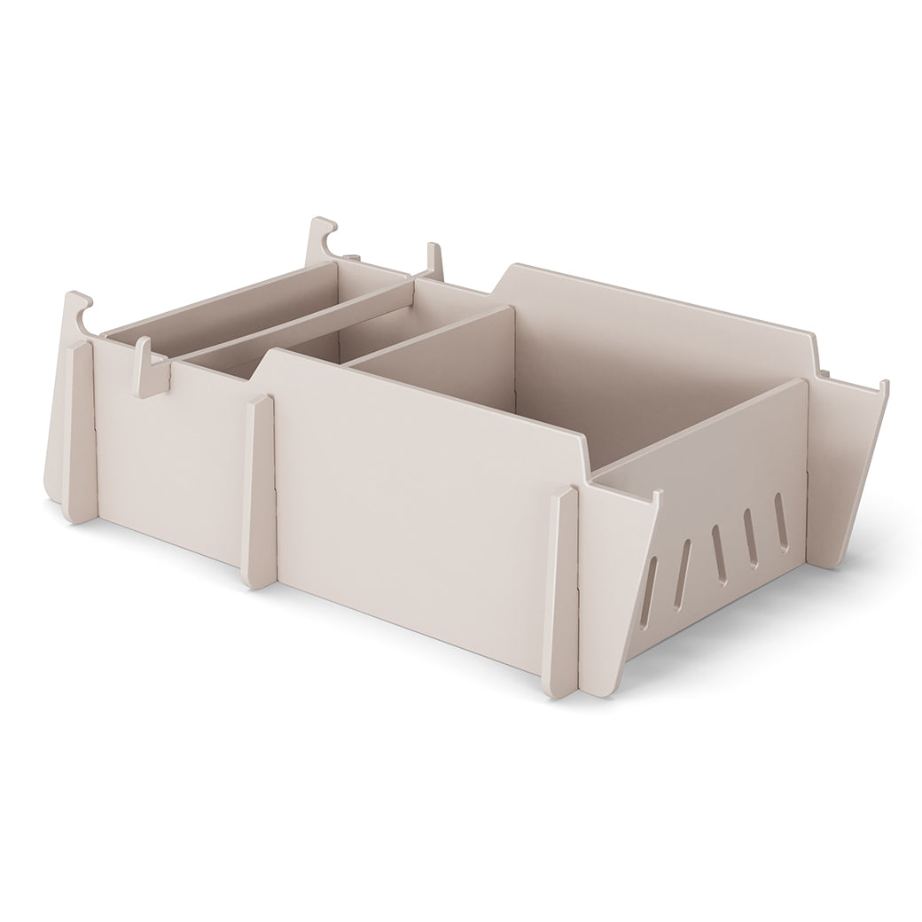 The Signature Lowback Chair Riser by Ledge Lounger offers modular compartments and side slots for efficient storage. Its minimalist, stackable design is perfect for elevated organization, seamlessly blending with any decor.