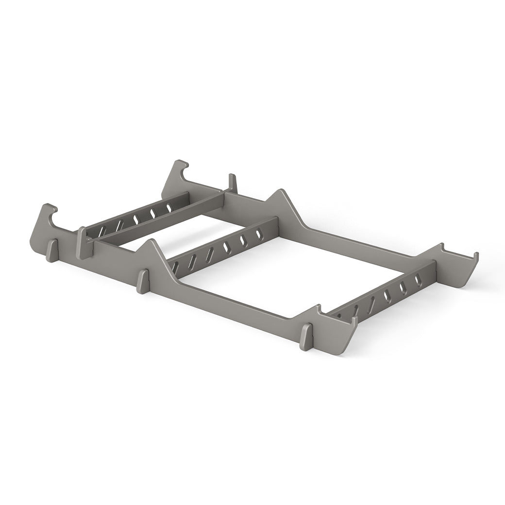 The Signature Chair Riser by Ledge Lounger is a gray, rectangular plastic rack with multiple slots and cut-out handles—ideal for in-pool seating or organizing essentials outdoors.