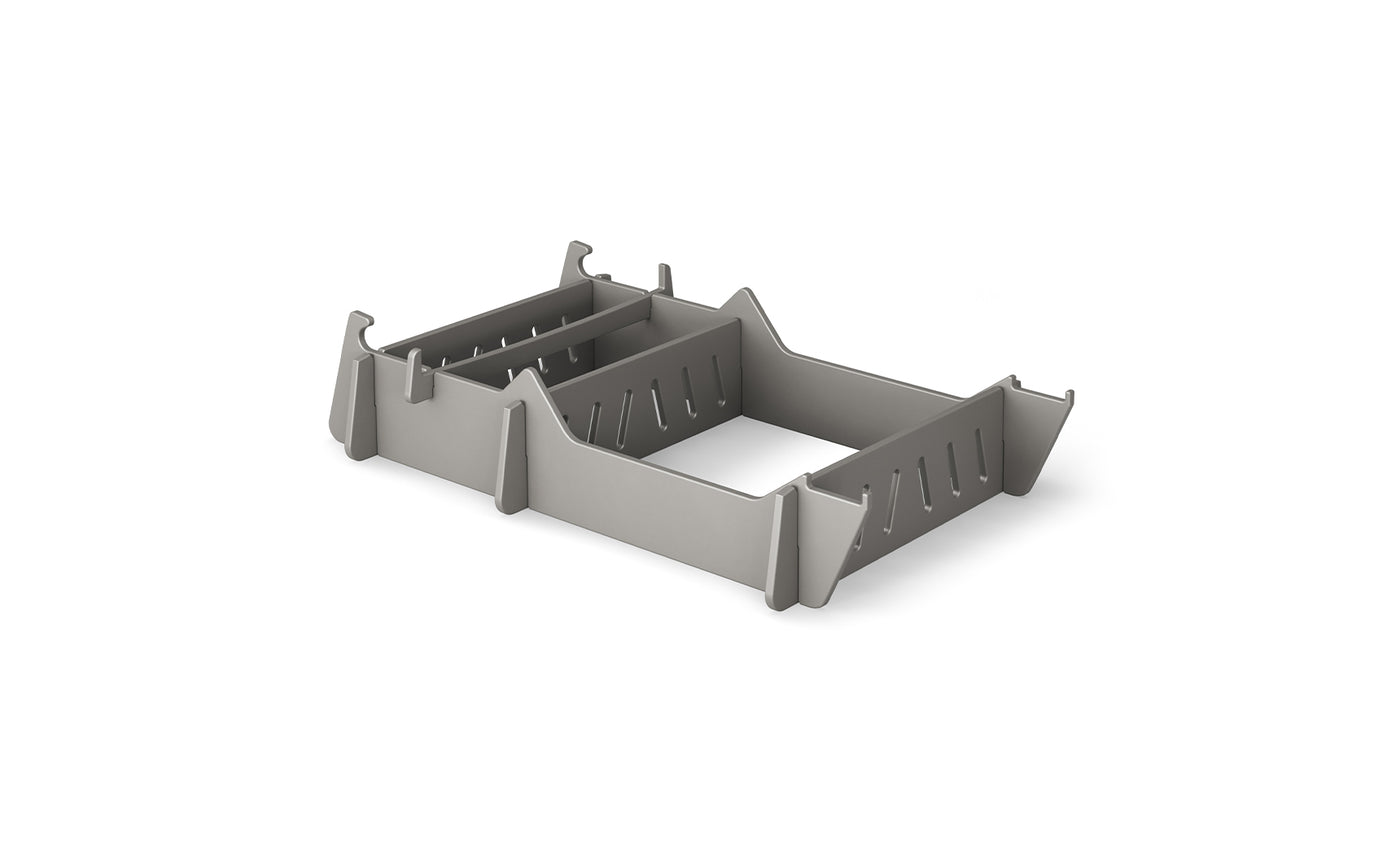 The Signature Chair Riser by Ledge Lounger is a gray, rectangular plastic organizer with vertical dividers and slotted sides, ideal for sorting stationery.
