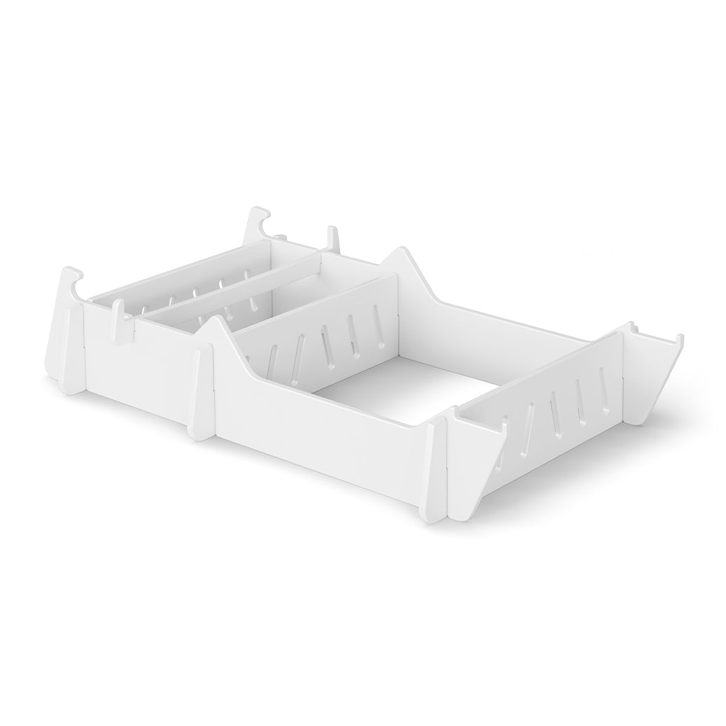The Ledge Lounger Signature Chair Riser features a white organizer with multiple compartments and slotted dividers for customizable storage, ideal for outdoor organizing against a plain white background.