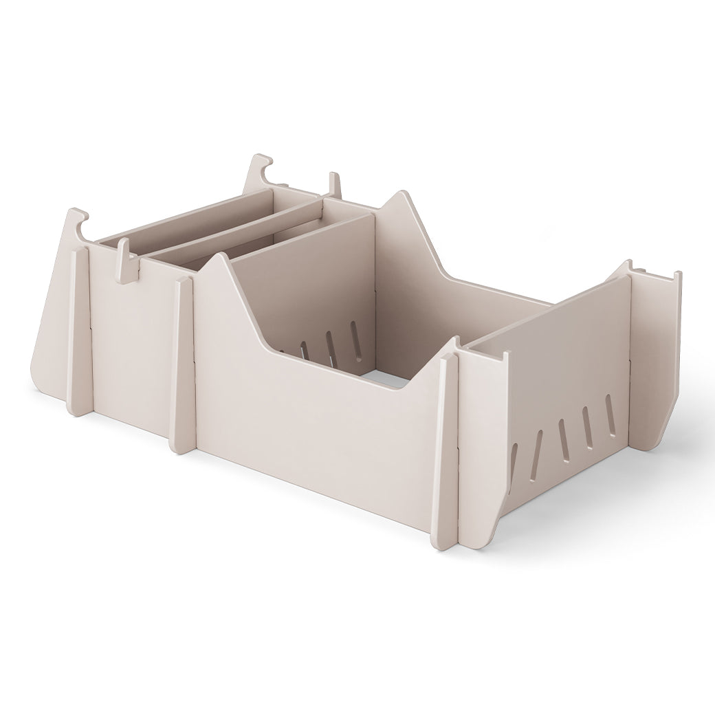 The Signature Chair Riser by Ledge Lounger is an ideal organizer for outdoor items with its beige modular design, adjustable dividers, slotted sides, and rectangular base.