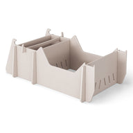 The Signature Chair Riser by Ledge Lounger is an ideal organizer for outdoor items with its beige modular design, adjustable dividers, slotted sides, and rectangular base.