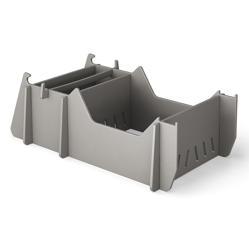 The Signature Chair Riser by Ledge Lounger is a gray, rectangular plastic organizer featuring multiple compartments and dividers. Its minimalist, modular design perfectly complements any workspace, just as in-pool seats enhance an outdoor day against a pristine white background.
