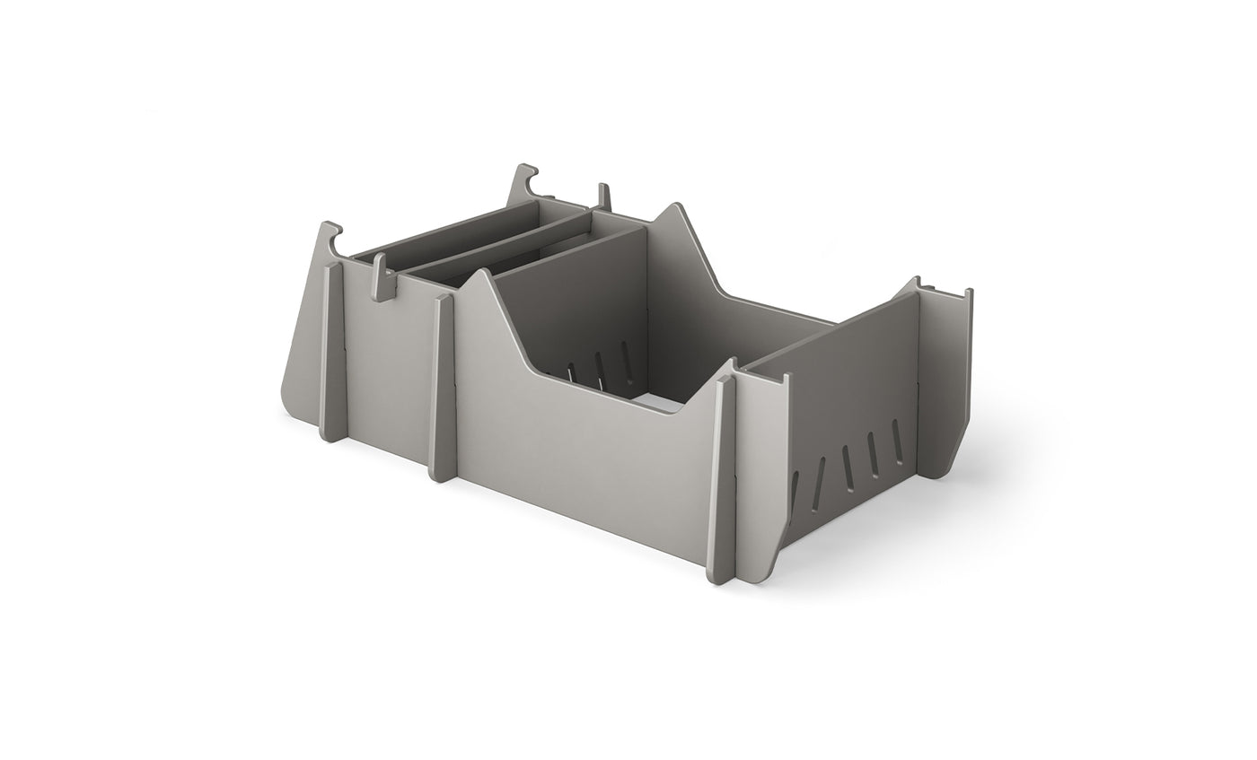 The Signature Chair Riser by Ledge Lounger is a gray, rectangular plastic organizer featuring multiple compartments and dividers. Its minimalist, modular design perfectly complements any workspace, just as in-pool seats enhance an outdoor day against a pristine white background.