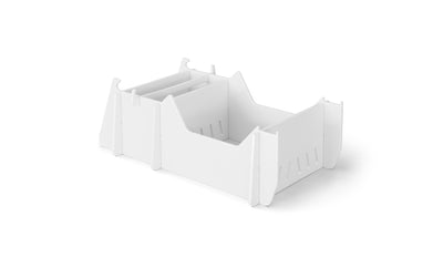 The Signature Chair Riser by Ledge Lounger is a white collapsible storage box with cut-out handles and interlocking panels for easy assembly and disassembly. It features slotted sides for ventilation and reinforcement, making it ideal for outdoor setups, all set elegantly on a plain white background.