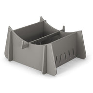 The Signature Chaise Riser by Ledge Lounger is a gray, modern geometric organizer with angled panels and vertical slots. Its minimalist style neatly stores papers or utensils, ideal for indoor and outdoor use.
