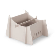 The Signature Chaise Riser by Ledge Lounger is a beige, foldable cardboard cat house with a contemporary design. It features four triangular sides, ventilation slits, and an arched roof opening, offering a cozy outdoor space for cats.