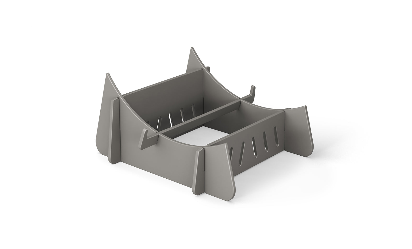 The Signature Chaise Riser by Ledge Lounger is a gray, rectangular plastic holder with divided sections and angled sides, ideal for organizing or stacking. It’s perfect for an outdoor day with vertical slots designed for ventilation or drainage.