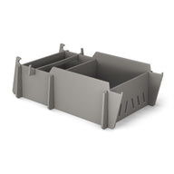 The Ledge Lounger Signature Lowback Chair With Medium Riser, shown on a white background, features sleek gray plastic and an ergonomic design—ideal for organizing accessories by the pool or outdoor lounge areas.