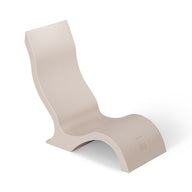 The Ledge Lounger Signature Chair With Short Riser is a modern beige lounge chair with a wavy ergonomic design and high backrest, perfect for stylish poolside seating, shown against a white background.
