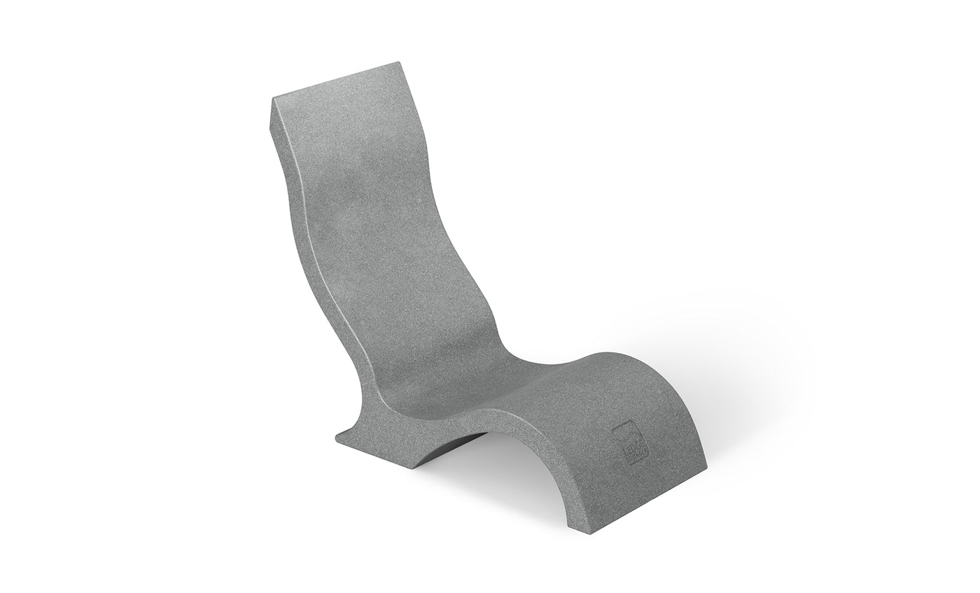 The Ledge Lounger Signature Chair With Short Riser is a modern gray lounge with smooth wave-like curves, crafted from solid material—ideal for stylish poolside seating and shown on a white background.