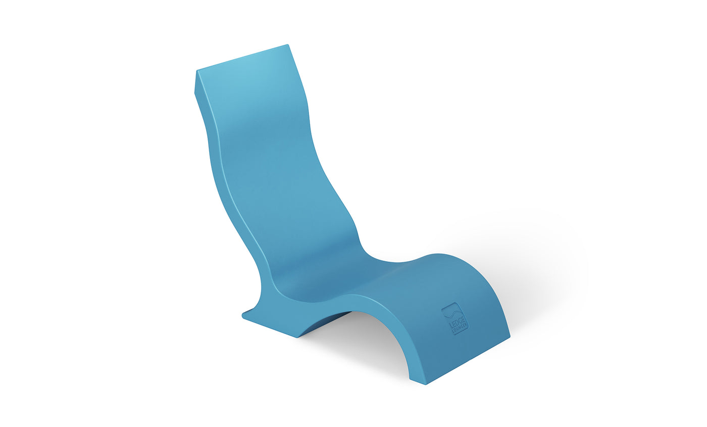The Ledge Lounger Signature Chair With Short Riser is a modern blue S-shaped pool lounger with smooth curves and a minimalist design, ideal for poolside seating and shown on a white background.