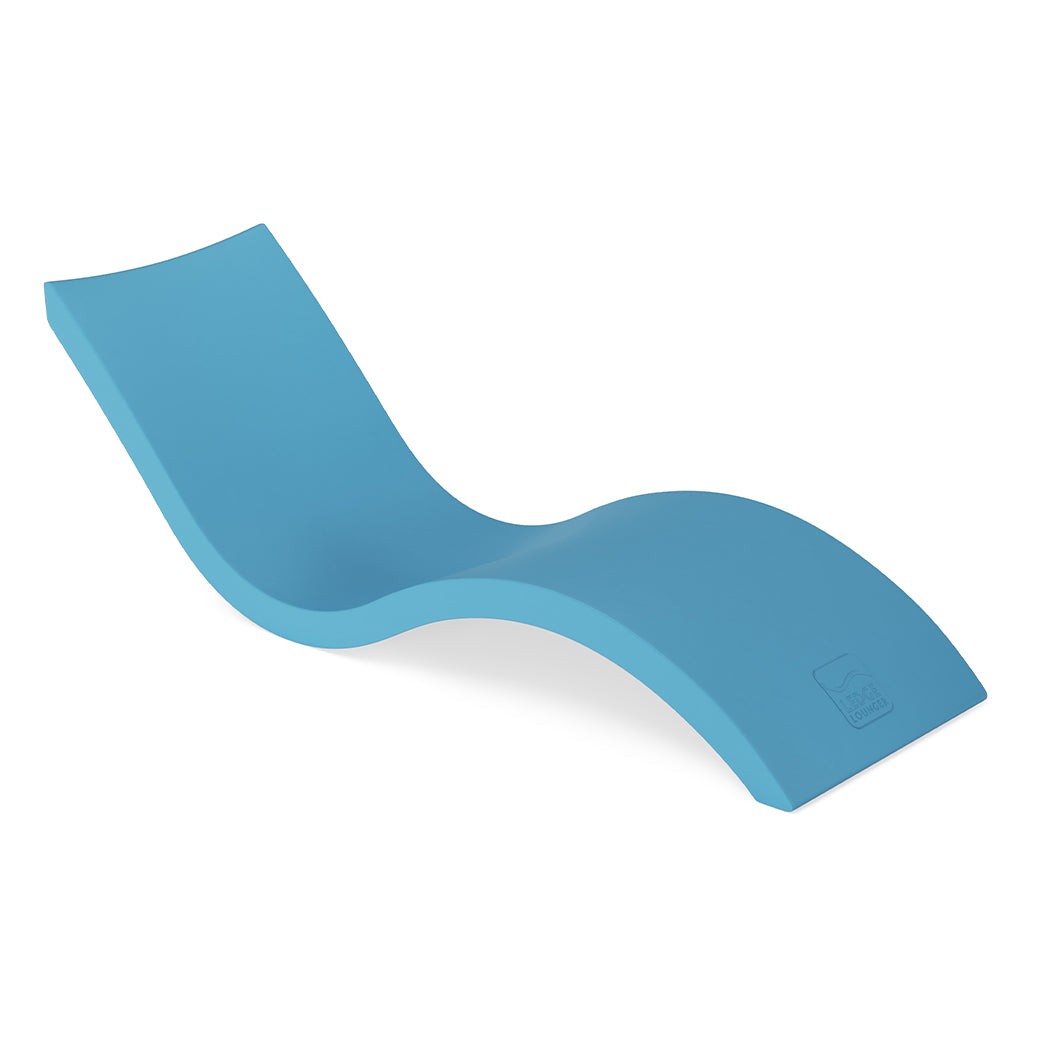 The Ledge Loungers Signature Chaise is a modern, blue lounger with a sleek S-curve and ergonomic design. Its smooth surface ensures comfort, perfect for poolside relaxation, and its minimalist style accentuates the lightweight feel.
