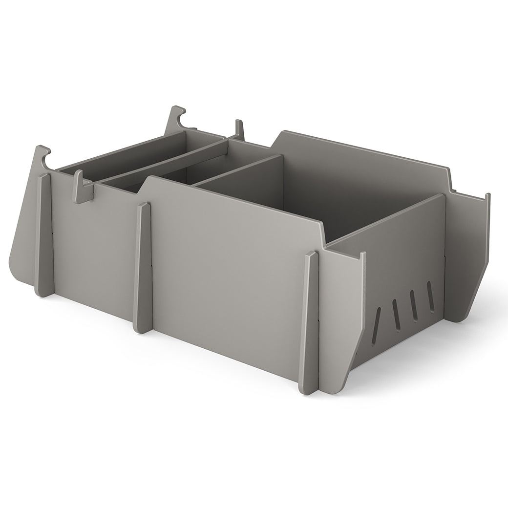 The Signature Lowback Chair Riser by Ledge Lounger is a gray modular storage solution with customizable interlocking compartments and slots, perfect for organizing and elevating your outdoor essentials against a white background.