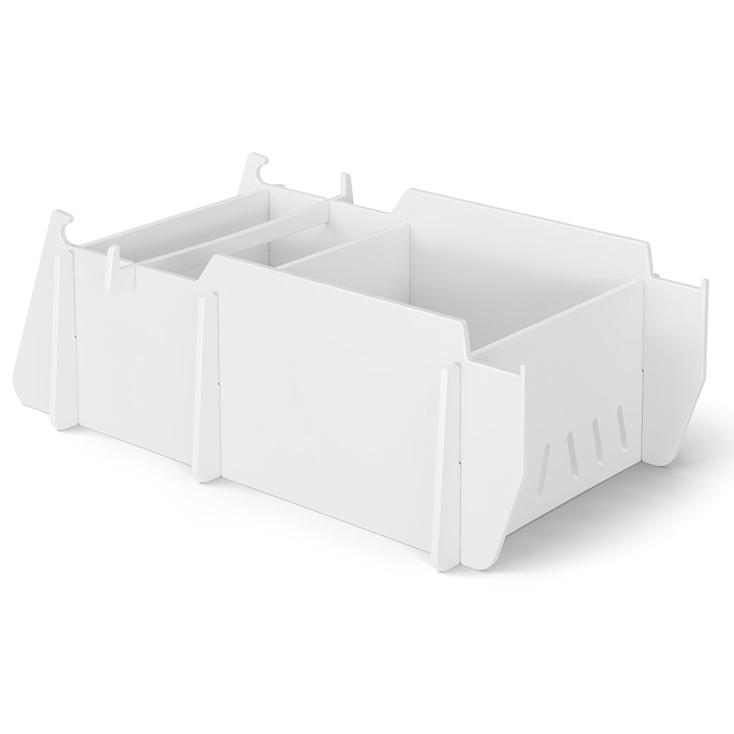 The sleek, white, rectangular modular desk organizer with multiple compartments and dividers is perfect for small office supplies. It complements any workspace, and when paired with Ledge Loungers Signature Lowback Chair Riser, it creates an elevated and organized setup. Background: plain white.