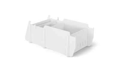The sleek, white, rectangular modular desk organizer with multiple compartments and dividers is perfect for small office supplies. It complements any workspace, and when paired with Ledge Loungers Signature Lowback Chair Riser, it creates an elevated and organized setup. Background: plain white.