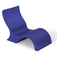 The Ledge Lounger Signature Lowback Chair With Short Riser is a modern blue poolside seat with a sleek, wave-like design and smooth surface, featuring a curved back and seat for stylish outdoor relaxation.