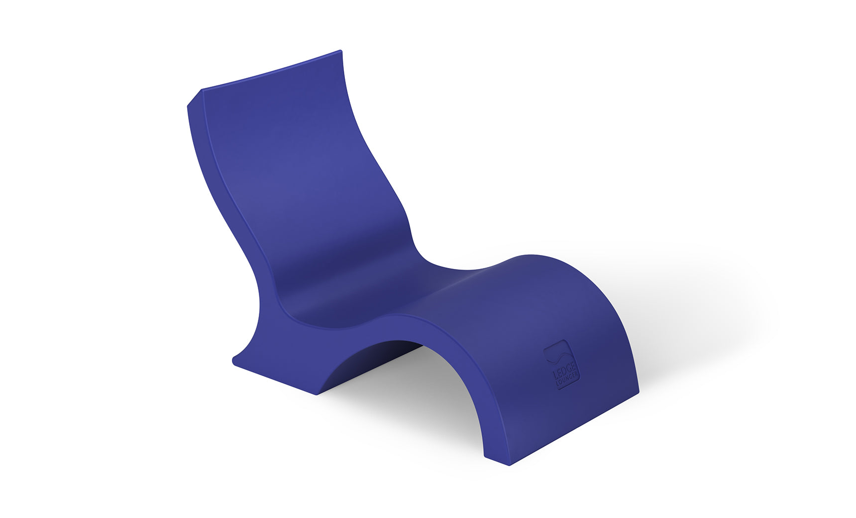The Ledge Lounger Signature Lowback Chair With Short Riser is a modern blue poolside seat with a sleek, wave-like design and smooth surface, featuring a curved back and seat for stylish outdoor relaxation.