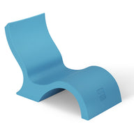 The Ledge Lounger Signature Lowback Chair With Short Riser is a modern, blue outdoor lounger featuring smooth curves and a minimalist design, ideal for poolside seating and showcased against a white background.
