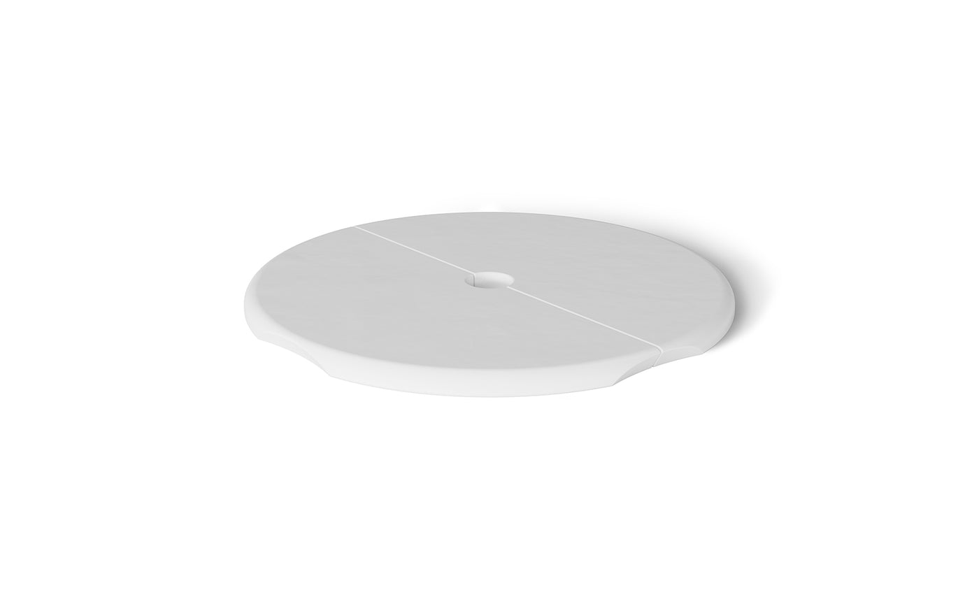 The Ledge Loungers Signature Side Table Lid with Umbrella Hole is a white, round, flat object featuring a subtle groove across its diameter. Resting against a plain white background, its an essential poolside necessity for any outdoor scene.