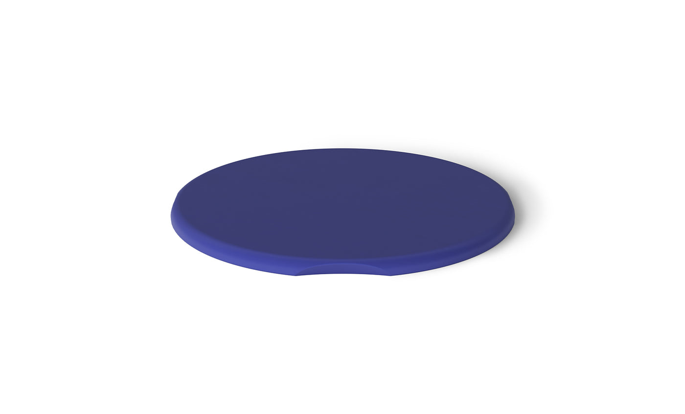 A matte-finished blue Signature Side Table Lid by Ledge Lounger is positioned centrally on a white background. It is circular with a small notch on one edge and casts a soft shadow to the right.