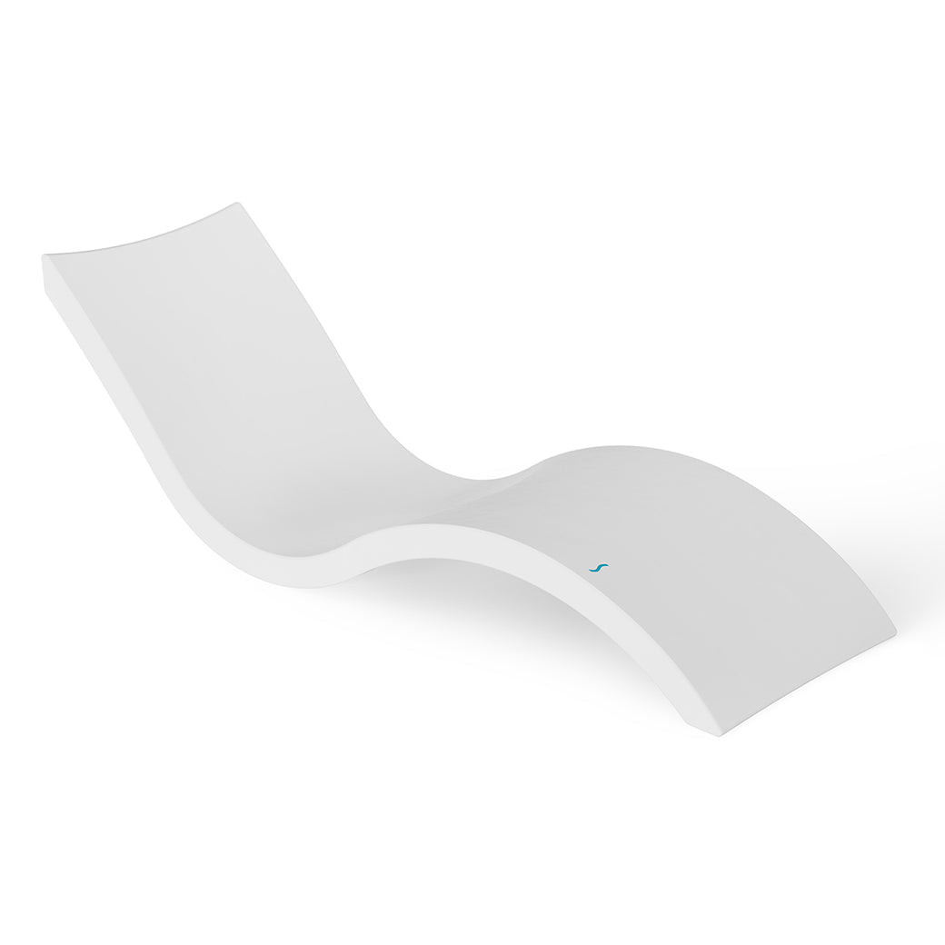 The Signature Chaise by Ledge Lounger is a sleek, modern white lounger featuring an ergonomic design with a smooth, curved silhouette against a plain white background, ideal for pool relaxation.