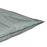 Close-up of the corner of a Laze Pillow Inner Bag by Ledge Lounger, showcasing its gray fabric, visible stitching, and textured surface, resting beside a Ledge Table Tennis Set with nearby ping pong paddles.