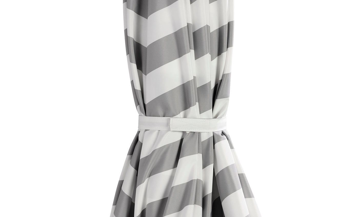 Gray and white chevron curtain gathered with a matching tieback adds elegance—perfect for pairing with the Ledge Lounger 8.5' Square Signature 360° Tilt Umbrella in luxury outdoor spaces.