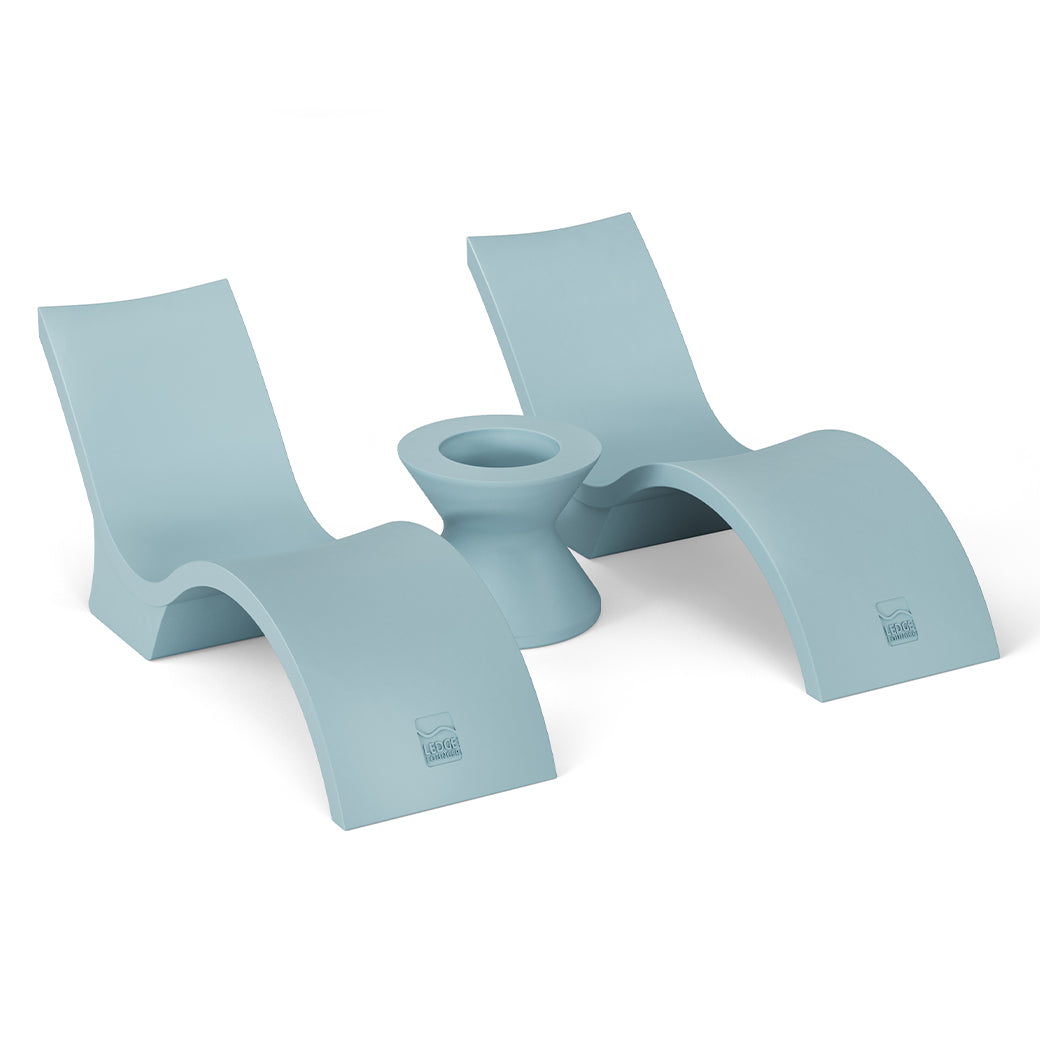 Two Ledge Lounger Outdoor Oasis In-Pool Furniture Bundle - Deep Chaise, modern light blue lounge chairs with smooth curves, sit beside an ice bin side table, showcasing sleek and minimalistic design elements.