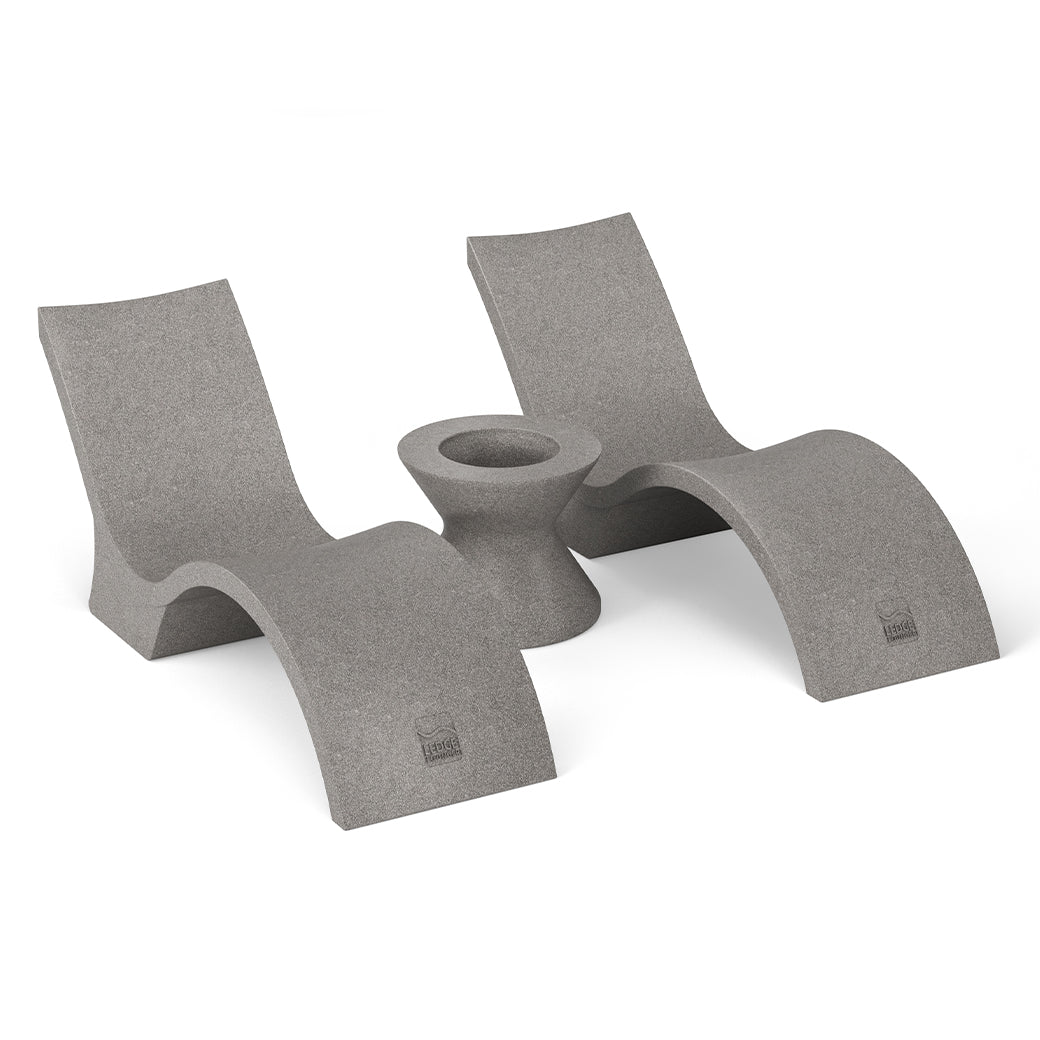 The Outdoor Oasis In-Pool Furniture Bundle - Deep Chaise by Ledge Lounger features gray, modern concrete loungers with curved designs, ideal for a minimalist pool ledge. Paired with a matching Ice Bin Side Table, its perfect against a plain white backdrop.