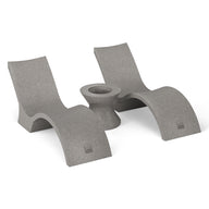 The Outdoor Oasis In-Pool Furniture Bundle - Deep Chaise by Ledge Lounger features gray, modern concrete loungers with curved designs, ideal for a minimalist pool ledge. Paired with a matching Ice Bin Side Table, its perfect against a plain white backdrop.
