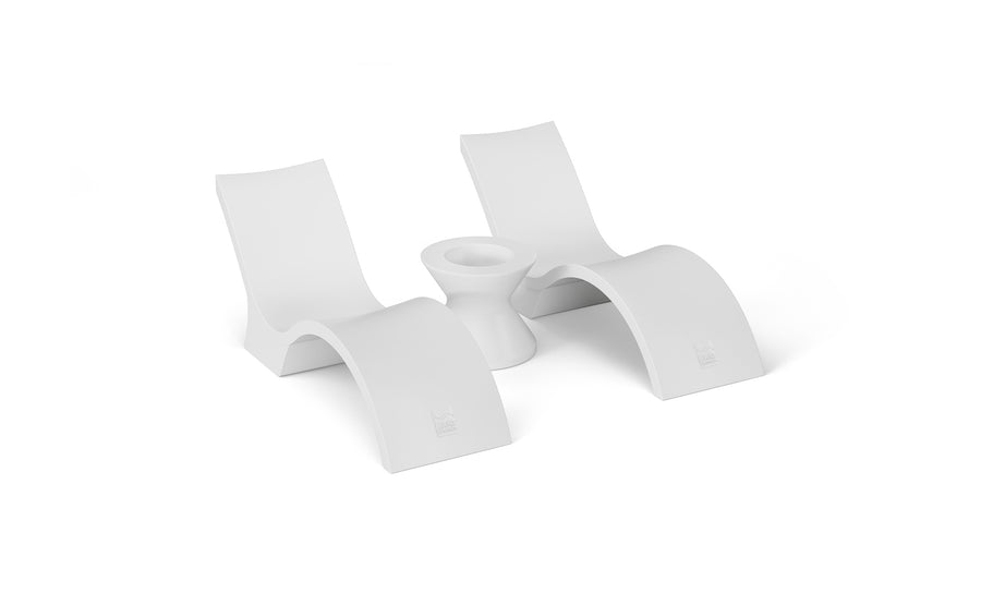 Two Outdoor Oasis In-Pool Deep Chaise loungers in a minimalist design with curved bases from Ledge Lounger flank a sleek ice bin side table, set against a plain white background.