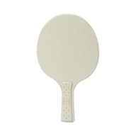The Ledge Lounger Table Tennis Paddle, in beige with an oval surface and subtly textured handle, is displayed against a white background, evoking the classic style of a handheld mirror.