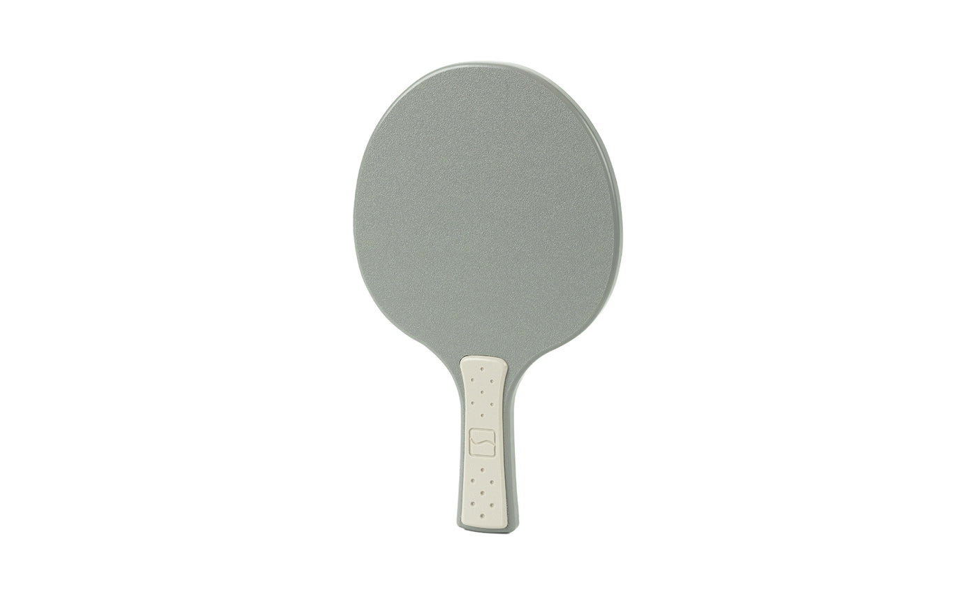A Ledge Lounger Table Tennis Paddle with a gray face and light gray handle is displayed against a white background, ideal for the Ledge Table Tennis Set.