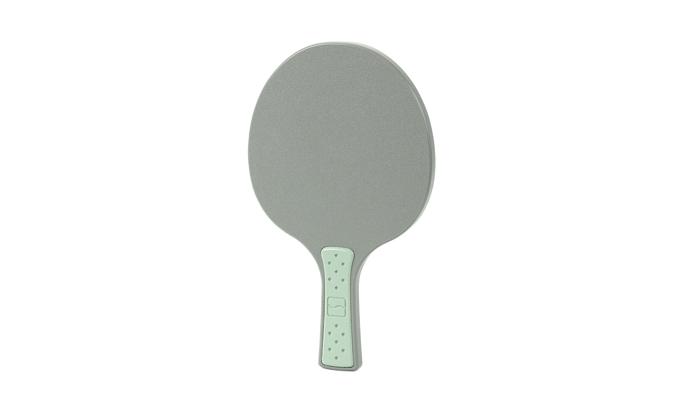 A gray and light green Table Tennis Paddle by Ledge Lounger, featuring a textured handle, is shown on a white background.