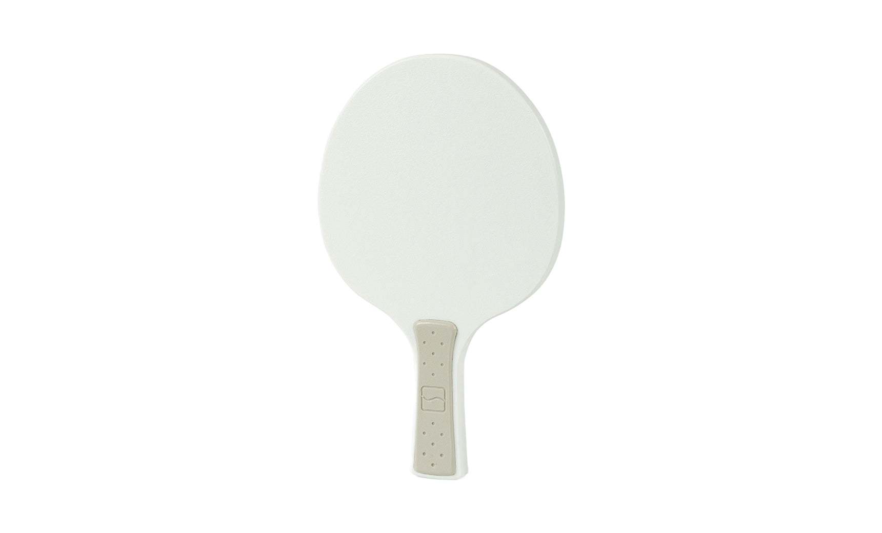 The Table Tennis Paddle by Ledge Lounger features a white plastic surface and a beige textured handle, resembling a traditional table tennis paddle, shown against a plain white background.